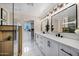 Bathroom with double sink vanity, and frameless glass shower enclosure at 2509 E Meadowbrook Ave, Phoenix, AZ 85016