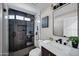 Modern bathroom with a walk-in shower, sleek fixtures, and contemporary design at 2509 E Meadowbrook Ave, Phoenix, AZ 85016