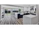 Open-concept kitchen with marble countertops, custom cabinets, and stainless steel appliances at 2509 E Meadowbrook Ave, Phoenix, AZ 85016