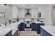 Elegant kitchen with stainless steel appliances, white countertops and modern fixtures at 2509 E Meadowbrook Ave, Phoenix, AZ 85016