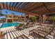 Community pool with lounge chairs and cabana at 2625 E Indian School Rd # 343, Phoenix, AZ 85016
