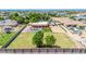 An aerial view of a home and the back yard with pool, patio, and landscaping at 2699 E Claxton Rd, Gilbert, AZ 85297
