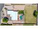 An aerial view of the house, back yard, pool, outdoor kitchen and landscaping at 2699 E Claxton Rd, Gilbert, AZ 85297