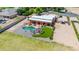 An aerial view of the backyard featuring a pool, grass, a patio and an outdoor kitchen at 2699 E Claxton Rd, Gilbert, AZ 85297