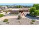 Aerial view of a single story home with desert landscaping, with mountains in the background at 2699 E Claxton Rd, Gilbert, AZ 85297
