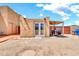 Backyard featuring a storage area and exterior door at 2699 E Claxton Rd, Gilbert, AZ 85297