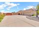 Spacious driveway leading to a multi-car garage and a gated entrance, providing ample parking and security at 2699 E Claxton Rd, Gilbert, AZ 85297