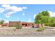Single story home with desert landscaping, a large cactus and a circular driveway at 2699 E Claxton Rd, Gilbert, AZ 85297