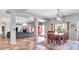 Open-concept living area with dining space, tile floors, neutral colors, and sliding door to the backyard at 2699 E Claxton Rd, Gilbert, AZ 85297
