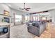 Bright, open living room with large couch, fireplace, and great natural light at 2699 E Claxton Rd, Gilbert, AZ 85297