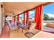 Inviting covered patio with draped openings, comfortable seating, backyard views, and ceiling fans at 2699 E Claxton Rd, Gilbert, AZ 85297