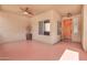 Enclosed patio with neutral walls, terracotta tile, and a wooden front door at 2699 E Claxton Rd, Gilbert, AZ 85297