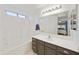 Well-lit bathroom featuring a tub/shower combo, vanity, and a large mirror for added convenience at 3011 W Salter Dr, Phoenix, AZ 85027