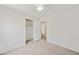 Bright bedroom featuring neutral carpet, a ceiling fan, closet space, and ample natural light at 3011 W Salter Dr, Phoenix, AZ 85027