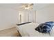 Spacious bedroom features a ceiling fan, neutral carpeting, and ample natural light at 3011 W Salter Dr, Phoenix, AZ 85027