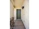 Inviting front door with stone accents, a secure lock system, and a modern black wall-mounted light at 3011 W Salter Dr, Phoenix, AZ 85027