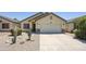 Charming single-story home with a two-car garage and low-maintenance desert landscaping at 3011 W Salter Dr, Phoenix, AZ 85027