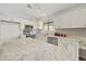 Bright kitchen featuring an island, stainless steel appliances and white cabinetry at 3011 W Salter Dr, Phoenix, AZ 85027