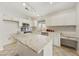 Bright kitchen featuring an island, stainless steel appliances and white cabinetry at 3011 W Salter Dr, Phoenix, AZ 85027