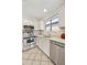 Well-equipped kitchen features stainless steel appliances, white cabinetry, and granite countertops at 3011 W Salter Dr, Phoenix, AZ 85027