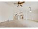 Open-concept living area flows into a bright kitchen with updated appliances and a central island at 3011 W Salter Dr, Phoenix, AZ 85027
