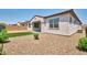 Charming backyard showcasing a cozy artificial turf area and low-maintenance gravel at 31570 N 123Rd Ln, Peoria, AZ 85383