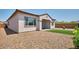 Charming backyard showcasing a cozy artificial turf area, complete with low-maintenance gravel at 31570 N 123Rd Ln, Peoria, AZ 85383