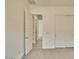 Bedroom with carpet flooring, access to doors, and built-in closets at 31570 N 123Rd Ln, Peoria, AZ 85383