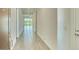 Bright entryway with tile flooring leading to an open living space and a view of the landscaped backyard at 31570 N 123Rd Ln, Peoria, AZ 85383