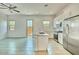Kitchen area featuring granite counters, stainless steel appliances and breakfast bar seating at 31570 N 123Rd Ln, Peoria, AZ 85383