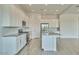 Modern kitchen with white cabinetry, stainless steel appliances, and a large island perfect for entertaining at 31570 N 123Rd Ln, Peoria, AZ 85383