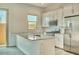 Kitchen featuring granite counters, stainless steel appliances and breakfast bar seating at 31570 N 123Rd Ln, Peoria, AZ 85383