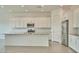 Bright kitchen featuring granite countertops, stainless steel appliances, and ample cabinet space at 31570 N 123Rd Ln, Peoria, AZ 85383