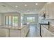 Contemporary kitchen with granite counters, tile backsplash, stainless steel appliances, and a large island with seating at 31570 N 123Rd Ln, Peoria, AZ 85383