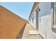 This side yard features a walkway leading to a convenient side entrance, and low-maintenance landscaping at 31570 N 123Rd Ln, Peoria, AZ 85383