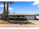 A well-maintained single-Gathering home features mature trees, desert landscaping, and a two-car garage at 3207 W Michigan Ave, Phoenix, AZ 85053