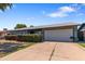 Charming single-story home with an attached two-car garage and beautiful desert landscaping at 3207 W Michigan Ave, Phoenix, AZ 85053