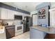 Functional kitchen with stainless steel appliances and ample cabinet space at 3207 W Michigan Ave, Phoenix, AZ 85053
