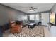Inviting living room featuring a comfortable sectional, modern decor, and a relaxing recliner at 3207 W Michigan Ave, Phoenix, AZ 85053