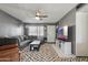 Comfortable living room with a cozy sectional, modern decor, and plenty of natural light at 3207 W Michigan Ave, Phoenix, AZ 85053
