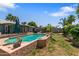 Beautiful backyard with a refreshing pool, lush landscaping, and ample space for outdoor entertaining at 3207 W Michigan Ave, Phoenix, AZ 85053