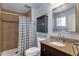 Bathroom features a granite countertop, dark wood vanity, and tiled shower at 3825 E Captain Dreyfus Ave, Phoenix, AZ 85032