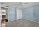 Bedroom featuring light blue walls, light-colored tile floor, and a bright window at 3825 E Captain Dreyfus Ave, Phoenix, AZ 85032