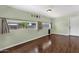 Bonus room featuring light green walls, hardwood floors, and a large window at 3825 E Captain Dreyfus Ave, Phoenix, AZ 85032