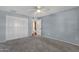 Bedroom features neutral carpet, ceiling fan and closet with white doors at 3825 E Captain Dreyfus Ave, Phoenix, AZ 85032