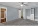 Bedroom boasts built-in closet, ceiling fan, and access to attached bathroom at 3825 E Captain Dreyfus Ave, Phoenix, AZ 85032