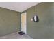 Inside the carport showcasing an EV charger and a convenient entrance into the home at 3825 E Captain Dreyfus Ave, Phoenix, AZ 85032