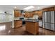 Updated kitchen featuring stainless appliances, dark counters, and colorful tile backsplash at 3825 E Captain Dreyfus Ave, Phoenix, AZ 85032