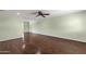 Bright and airy living space featuring hardwood floors, a ceiling fan, and a versatile, open layout at 3825 E Captain Dreyfus Ave, Phoenix, AZ 85032