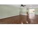 Spacious living room with hardwood floors offering a versatile, open layout and seamless flow to other living areas at 3825 E Captain Dreyfus Ave, Phoenix, AZ 85032